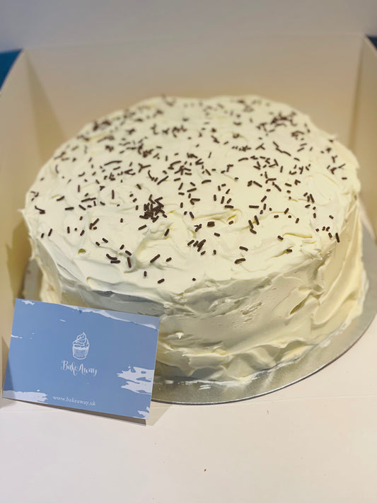 Red Velvet Sponge Covered In Cream Cheese Frosting